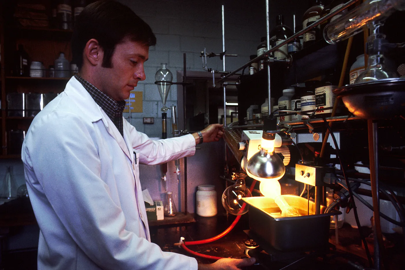 An archival photograph of a chemist at work in a college laboratory